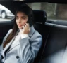 businesswoman sitting her car talking phone scaled webp 95x90